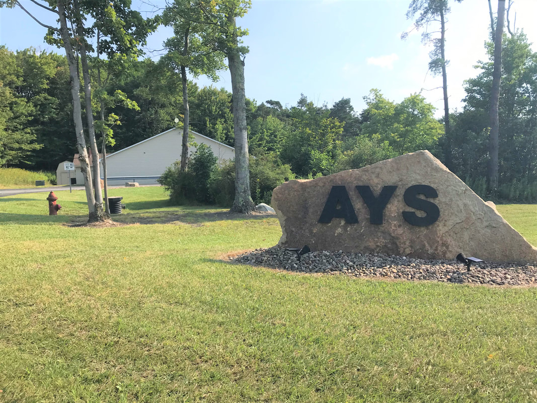 AYS front rock sign in front of the campus. 