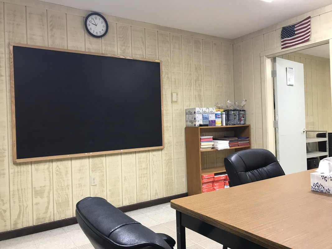Classroom / study room with chalkboard in Day Treatment.