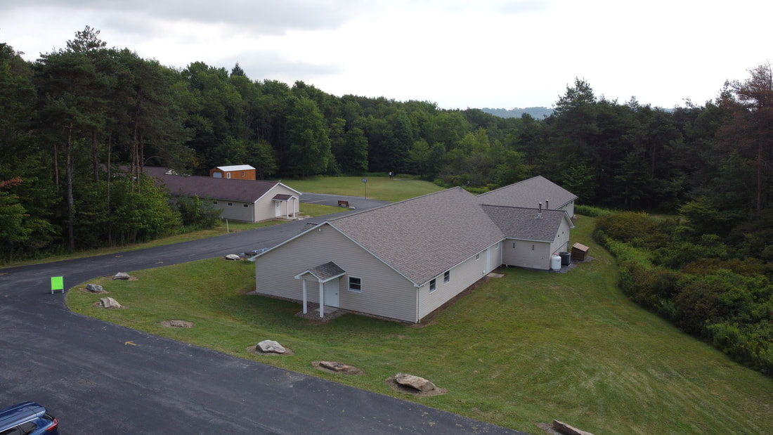 Aerial picture of Kathys House, the Main office and the grounds from the top of the hill. 
